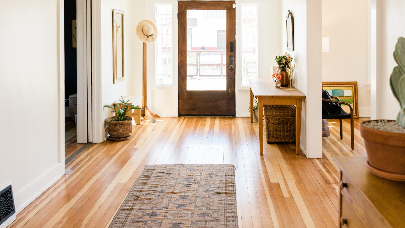 A room with a wooden floor and a door